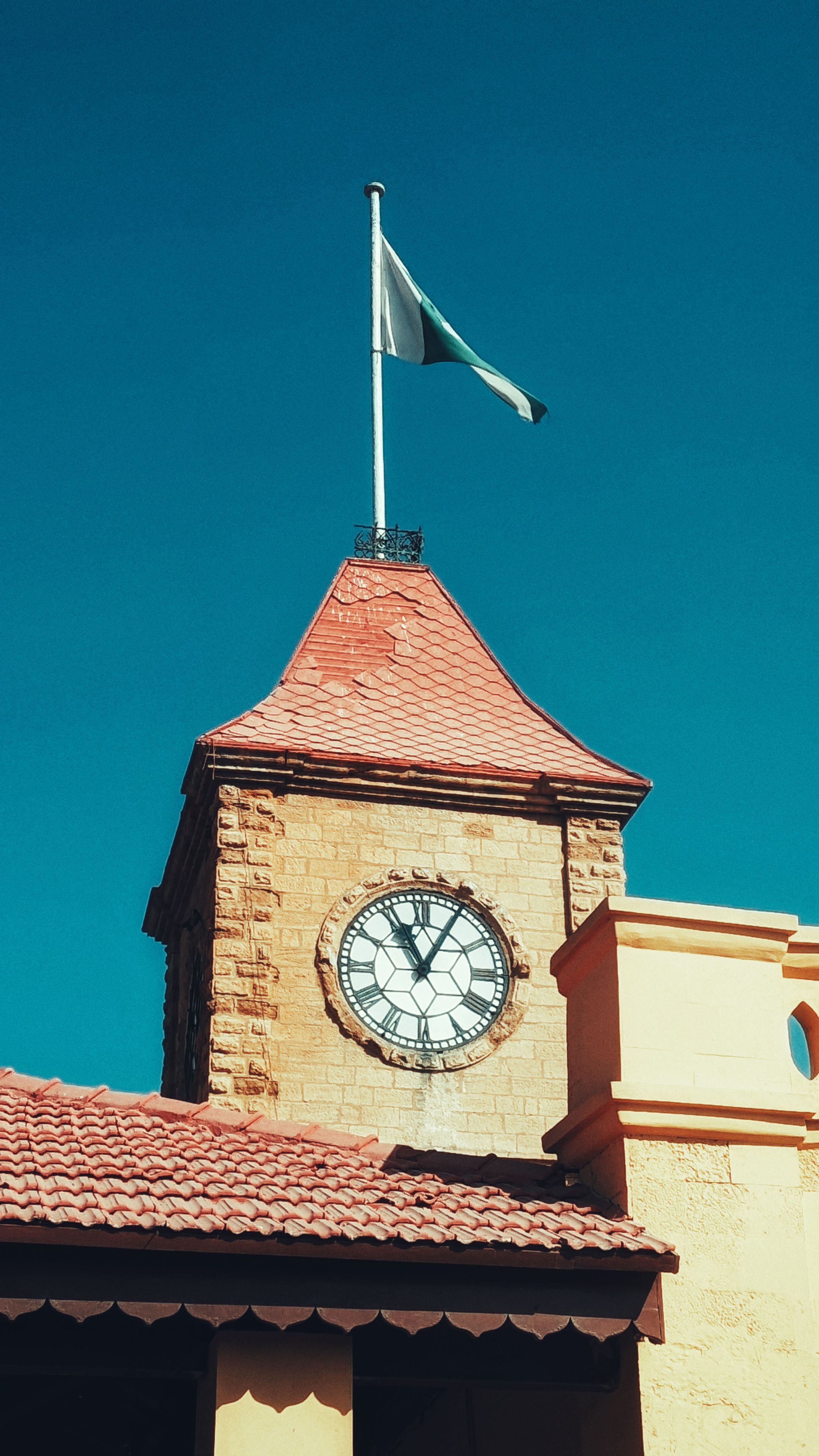 Historic Clock Tower against Clear Blue Sky · Free Stock Photo