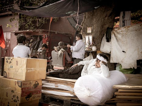 A candid scene of a street barber shop in Old Delhi, capturing the essence of local life and culture.