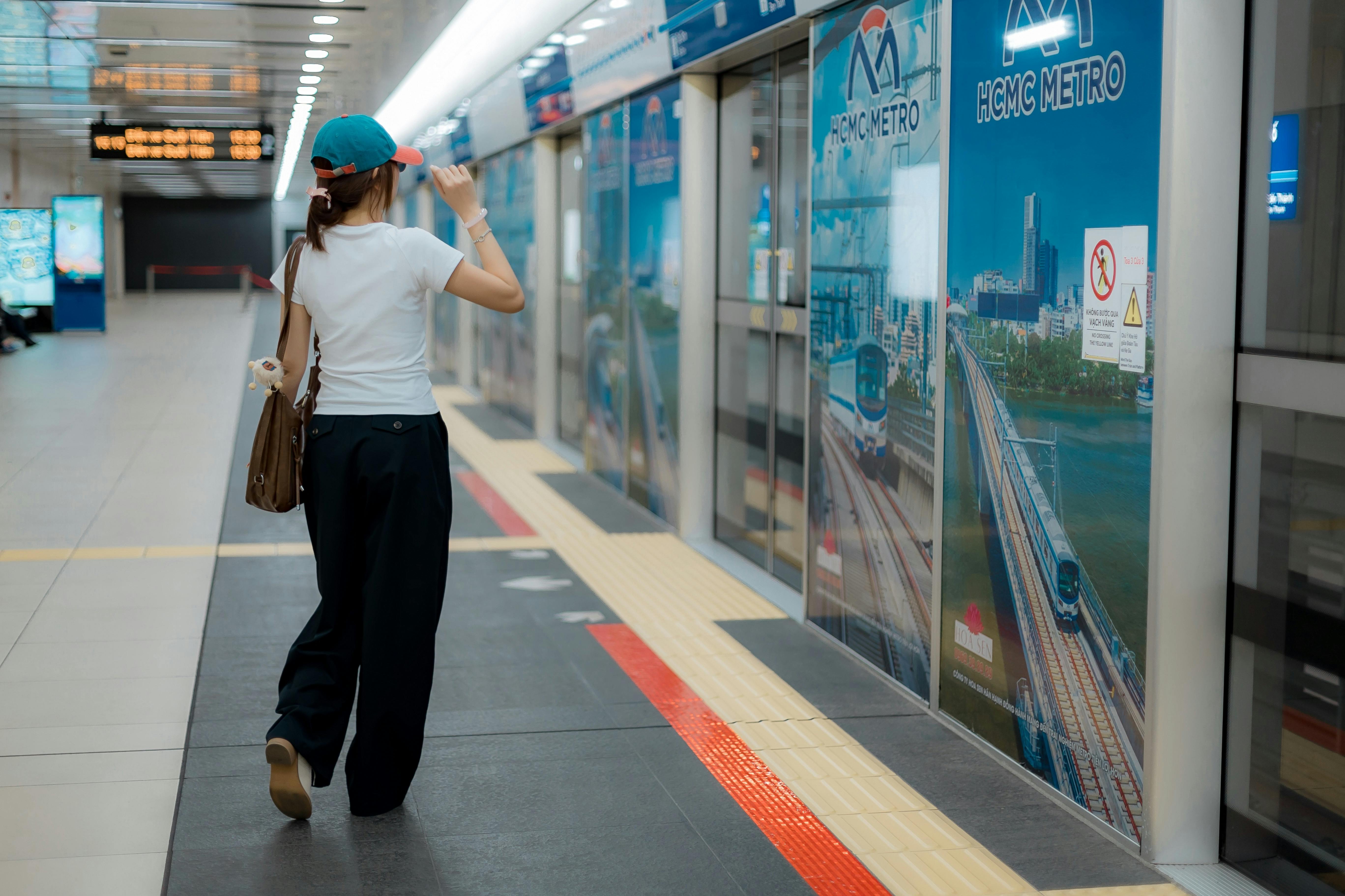 Young woman walking in a metro station in Ho Chi Minh City, Vietnam.