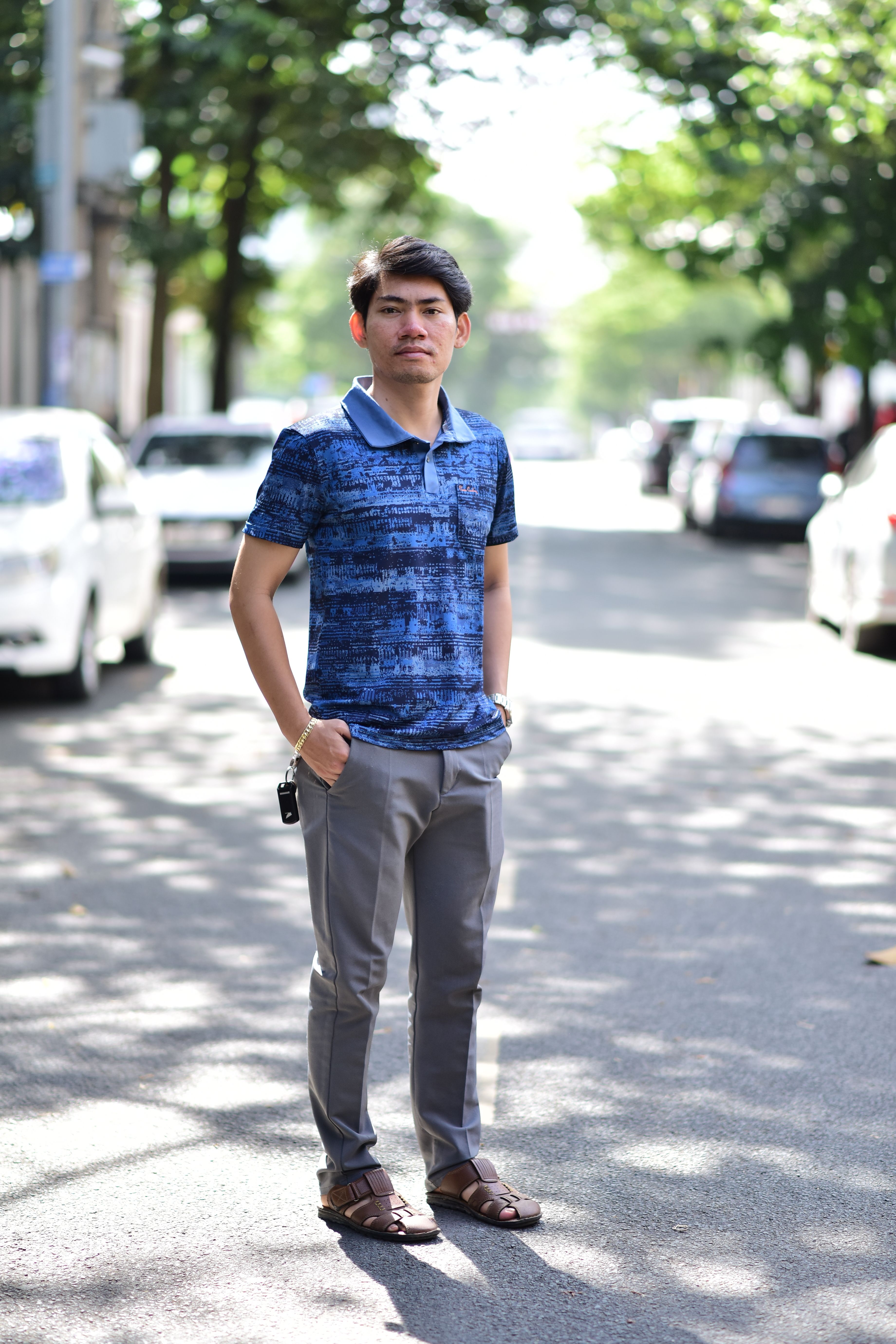 Stylish Young Man Posing on a Sunny Urban Street · Free Stock Photo
