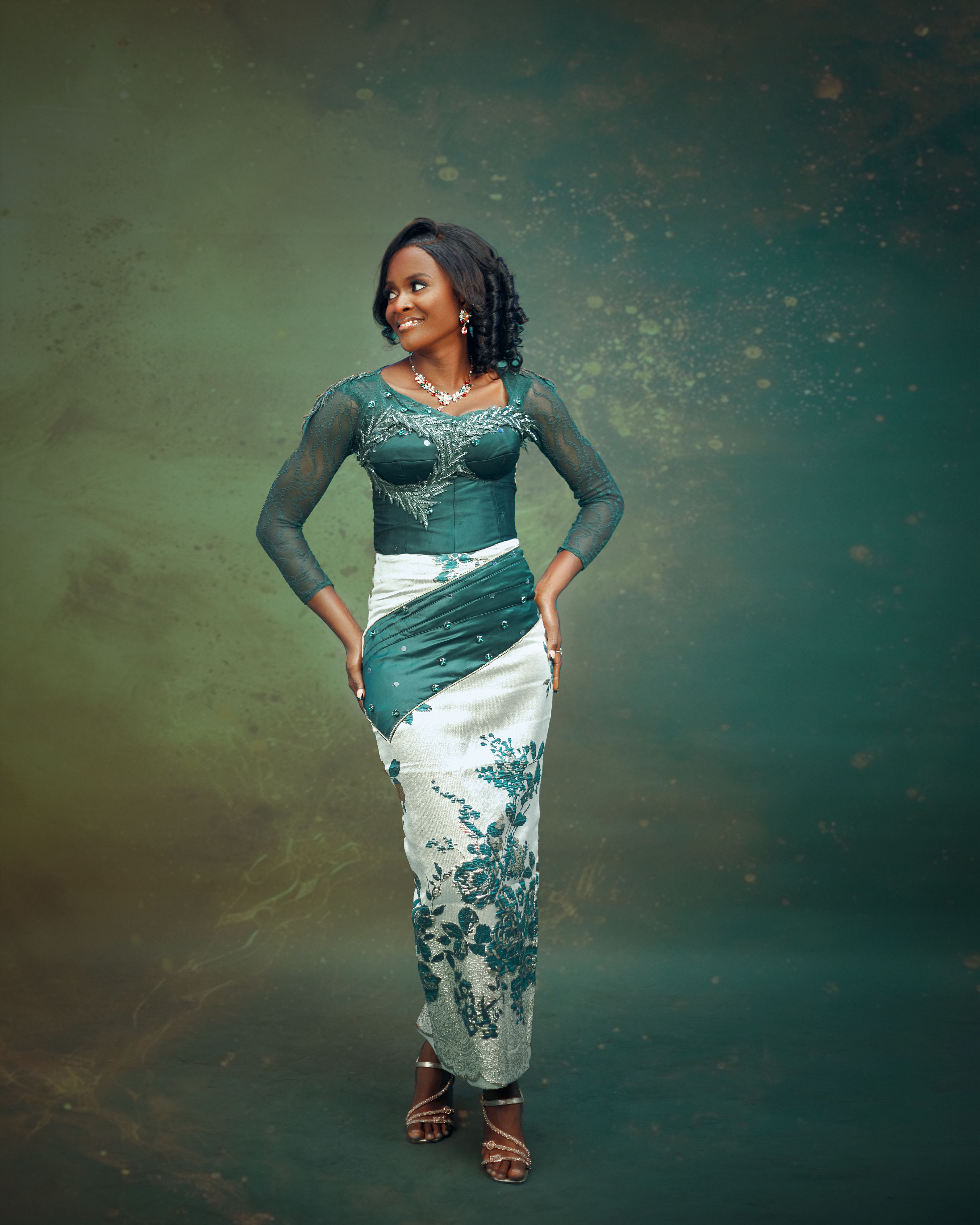 Elegant Woman in Traditional Green Dress · Free Stock Photo