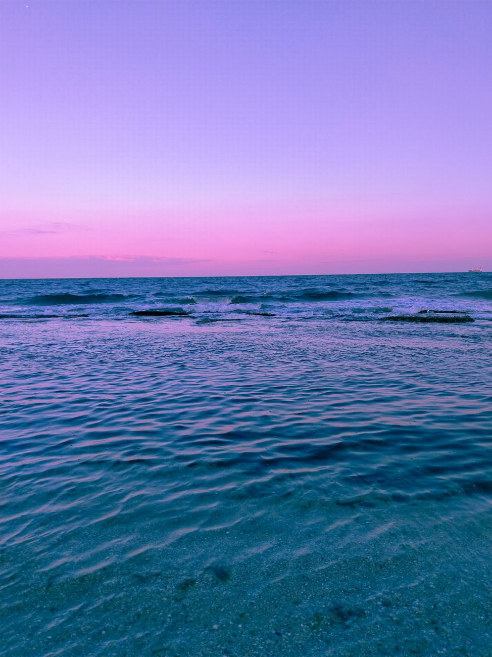A tranquil pink sunset paints the sky over the Tekirdağ sea, capturing the essence of Turkish coastal beauty.