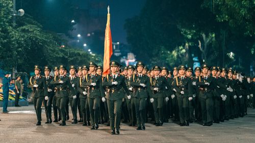 Free A disciplined military parade taking place at night on the streets of Hà Nội, Vietnam. Stock Photo