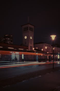 Capture the vibrant energy of a city at night with neon light trails and moody atmosphere.