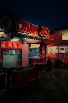 Cinematic night view of China Box food stall with neon lights in Malmö, Sweden.