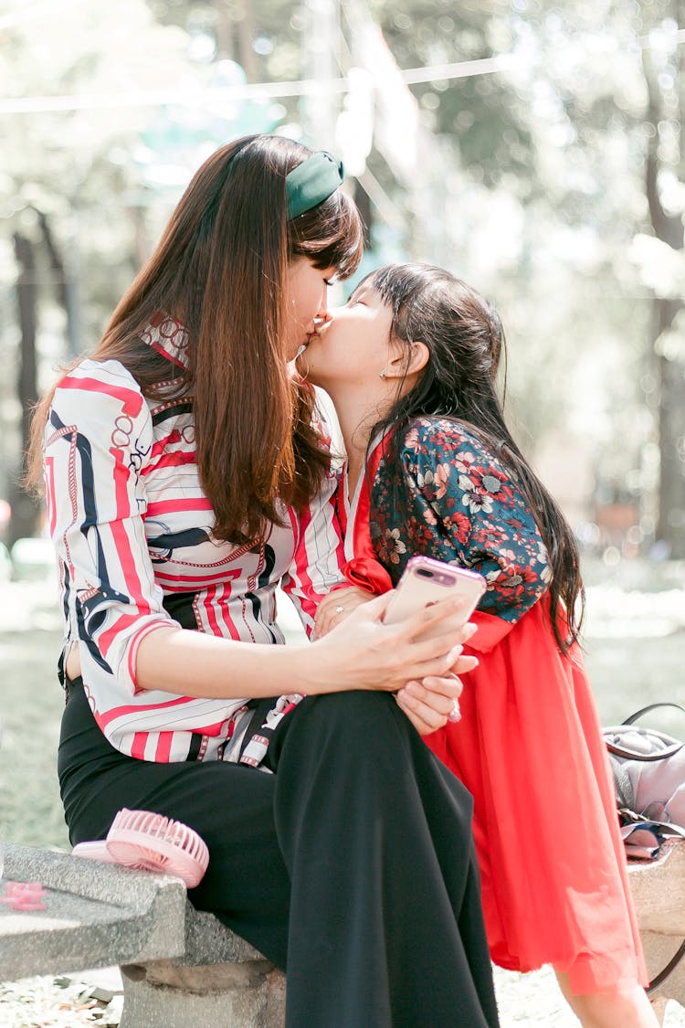 Girl Kissing Her Mother