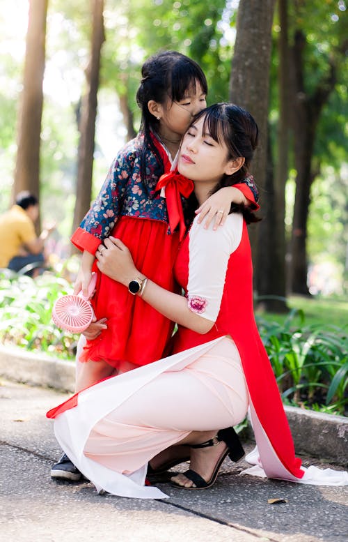 Free Girl Kissing Her Mother Stock Photo