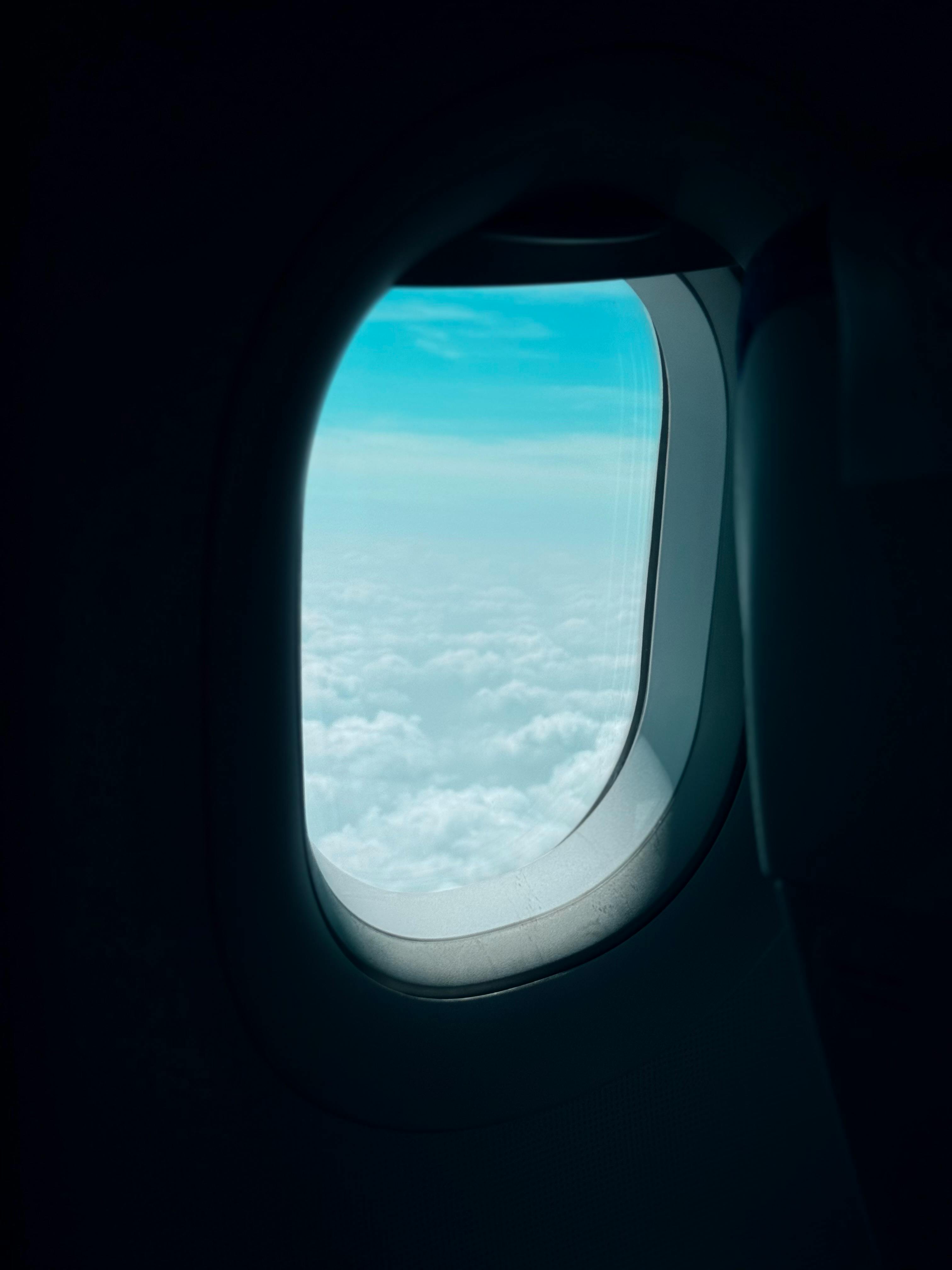Free stock photo of above clouds, airplane window, plane window