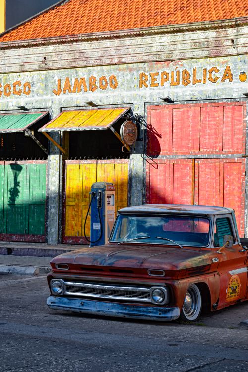Vintage Truck in Front of Colorful Urban Wall · Free Stock Photo