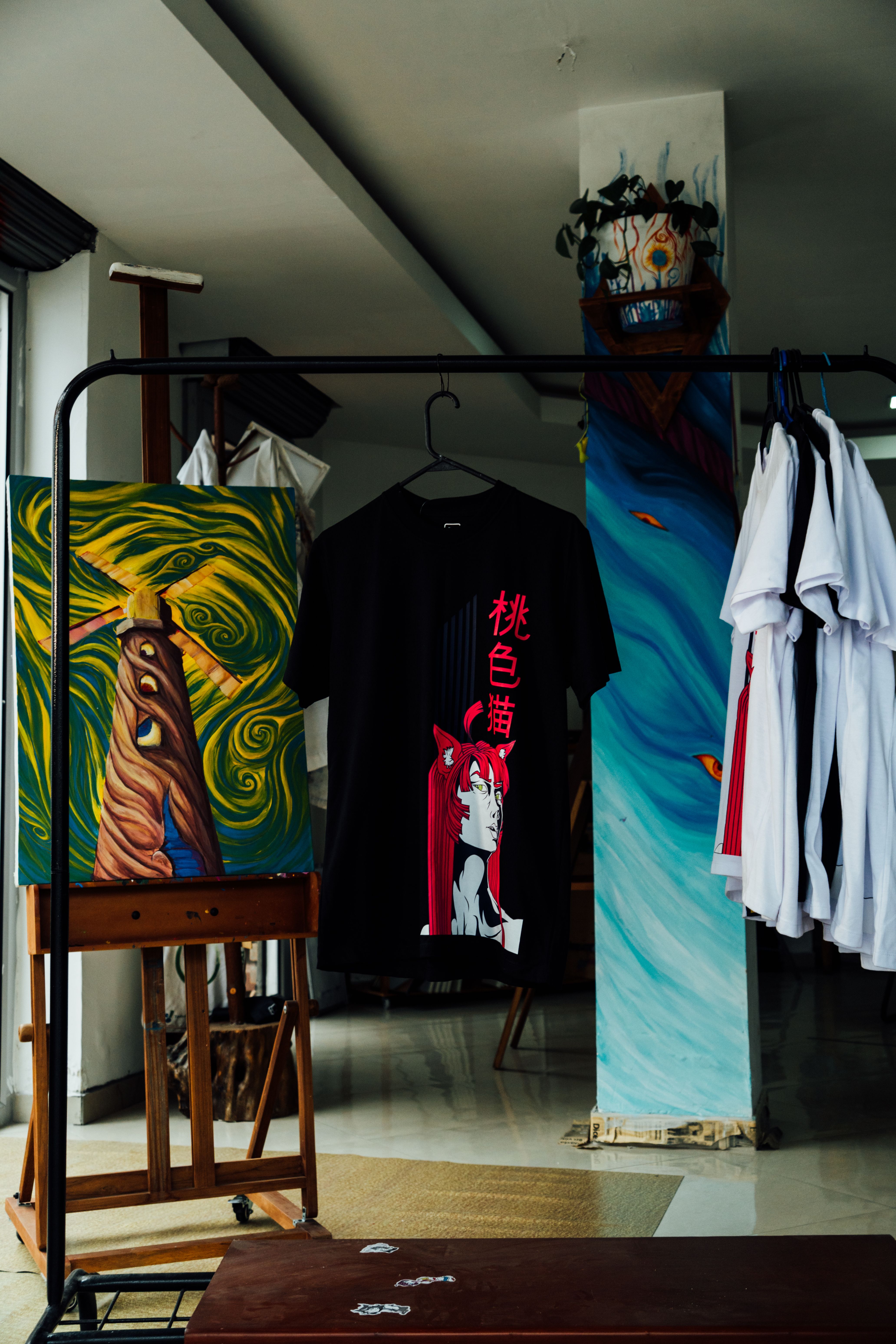 Artistic T-Shirt Display in Modern Gallery · Free Stock Photo