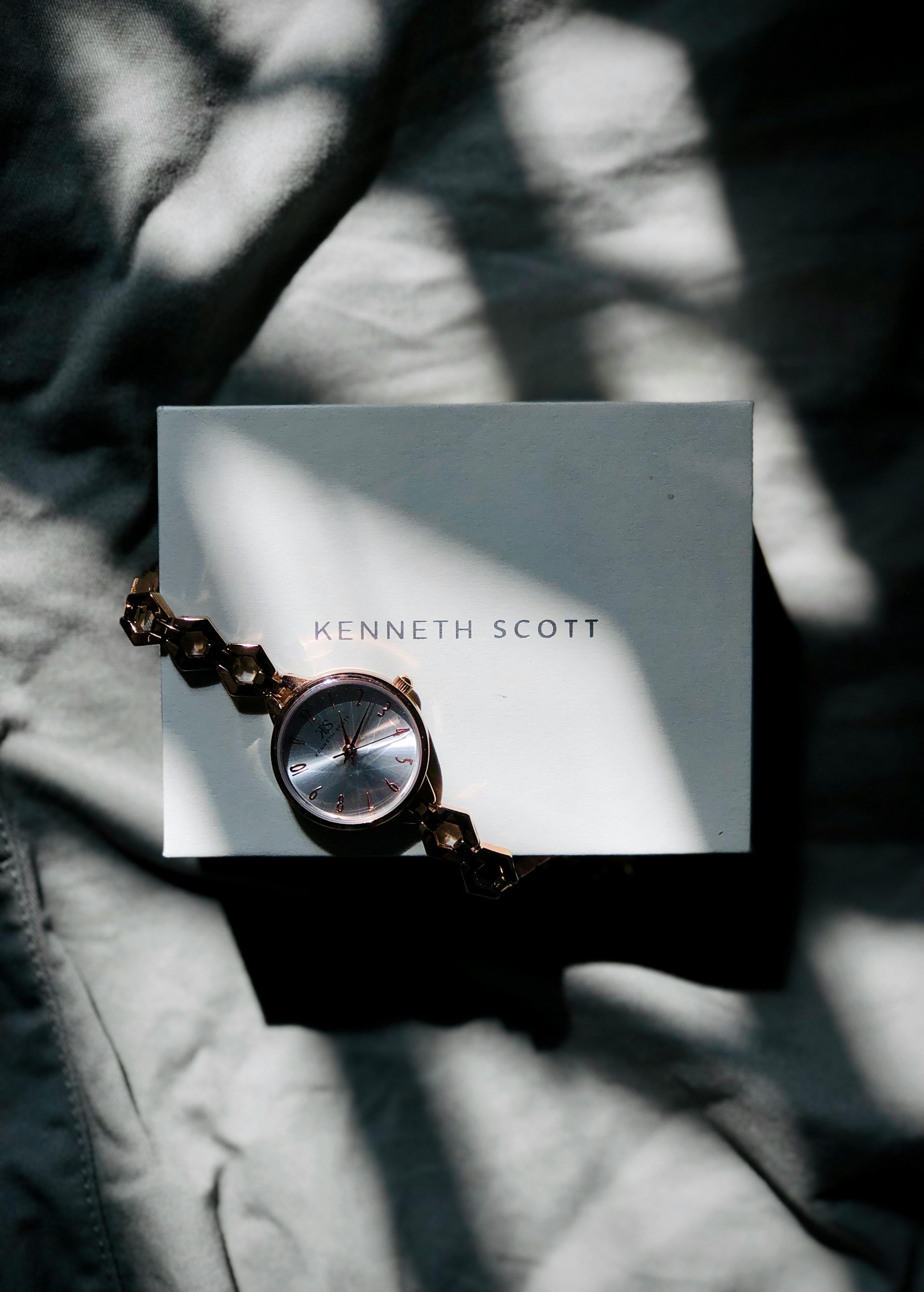 Luxurious watch on a branded box, with dynamic light and shadows. Perfect for fashion and lifestyle themes.