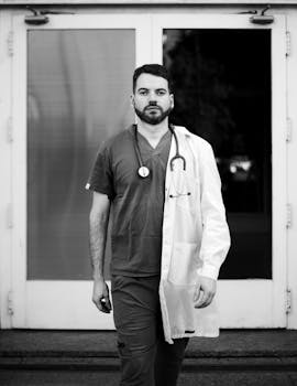 Monochrome portrait of a doctor in Buenos Aires hospital setting, conveying professionalism.