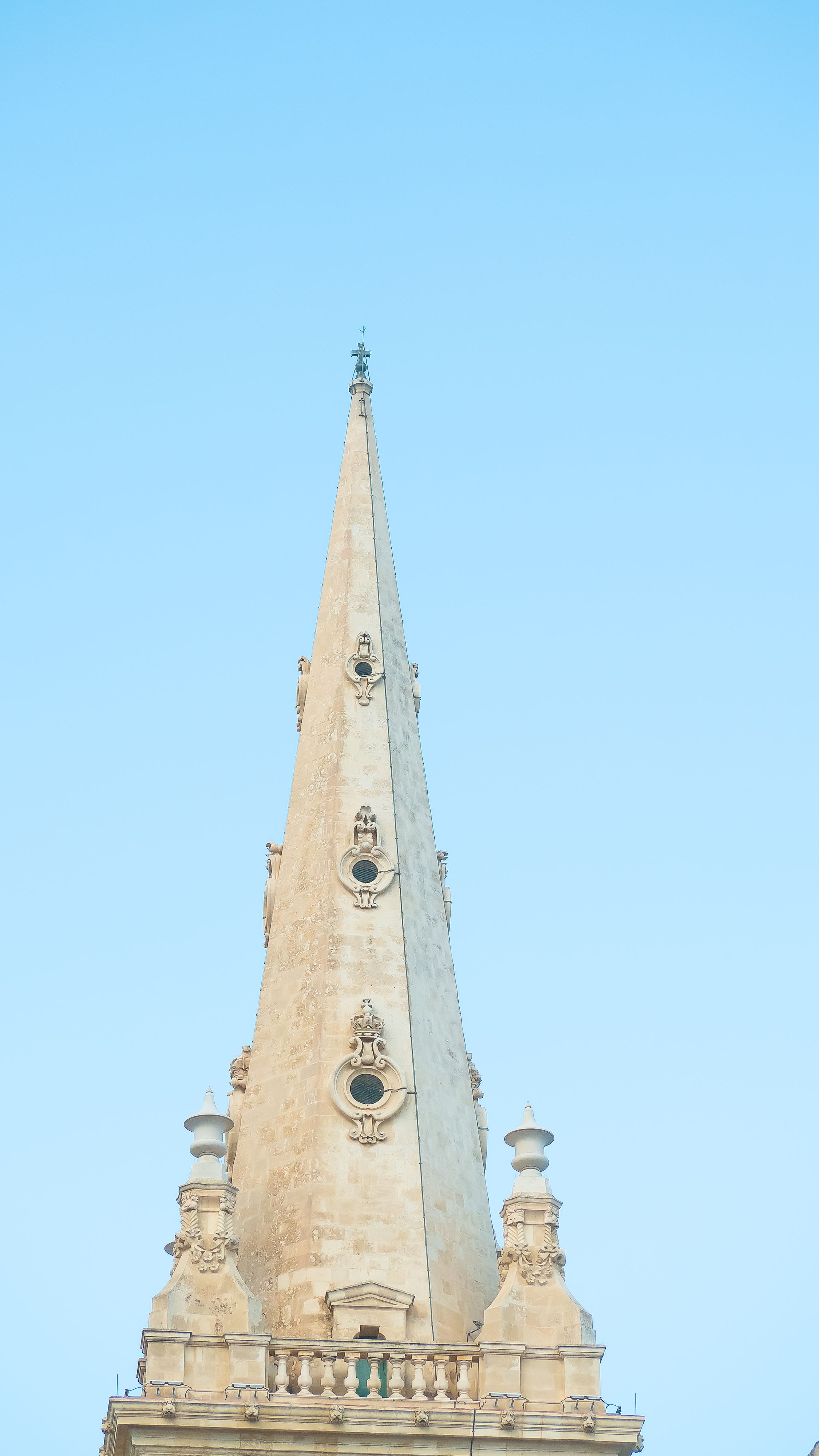 Gothic Cathedral Spire Against Blue Sky · Free Stock Photo