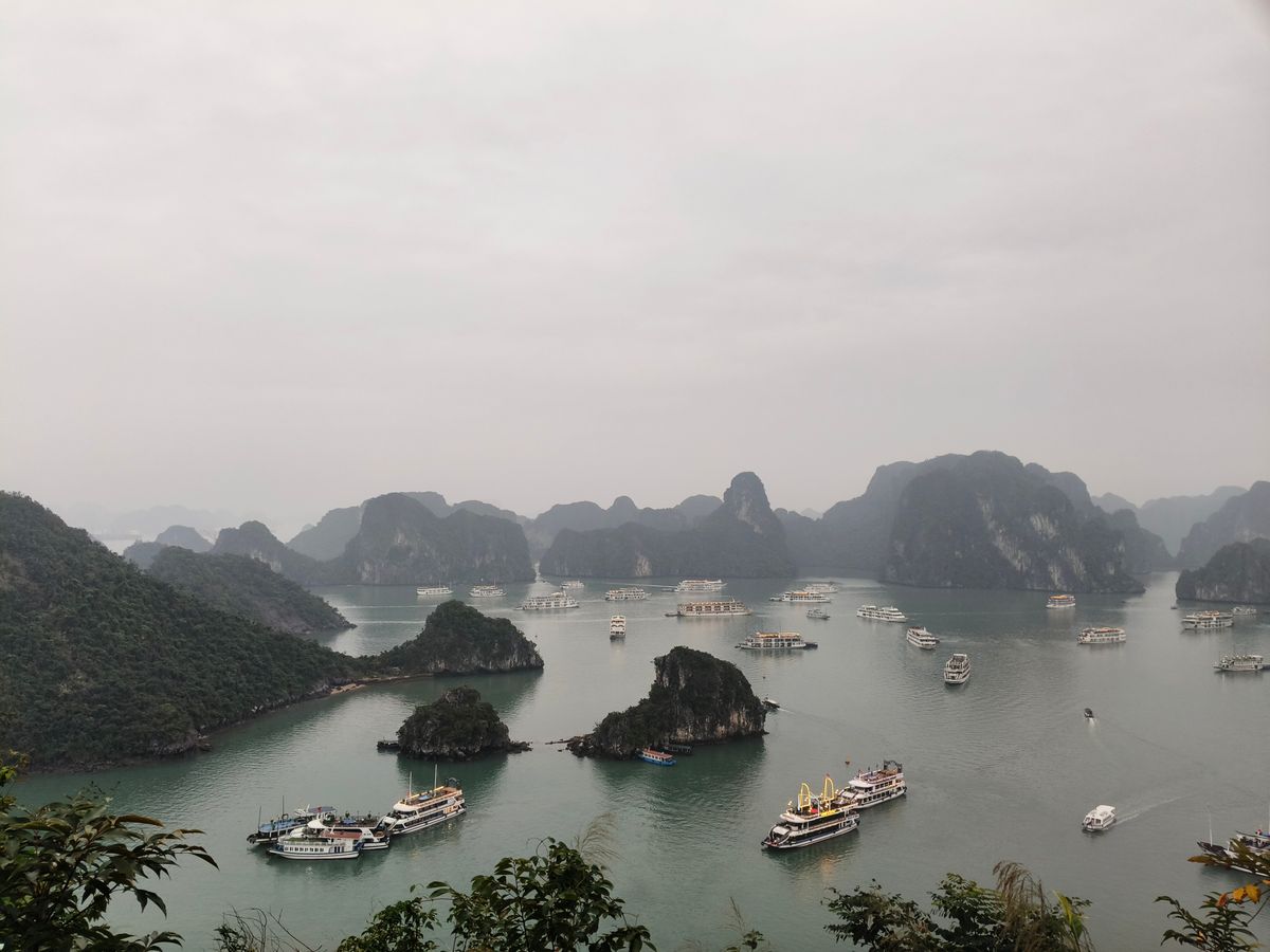 Cruise boats among limestone islands in Ha Long Bay