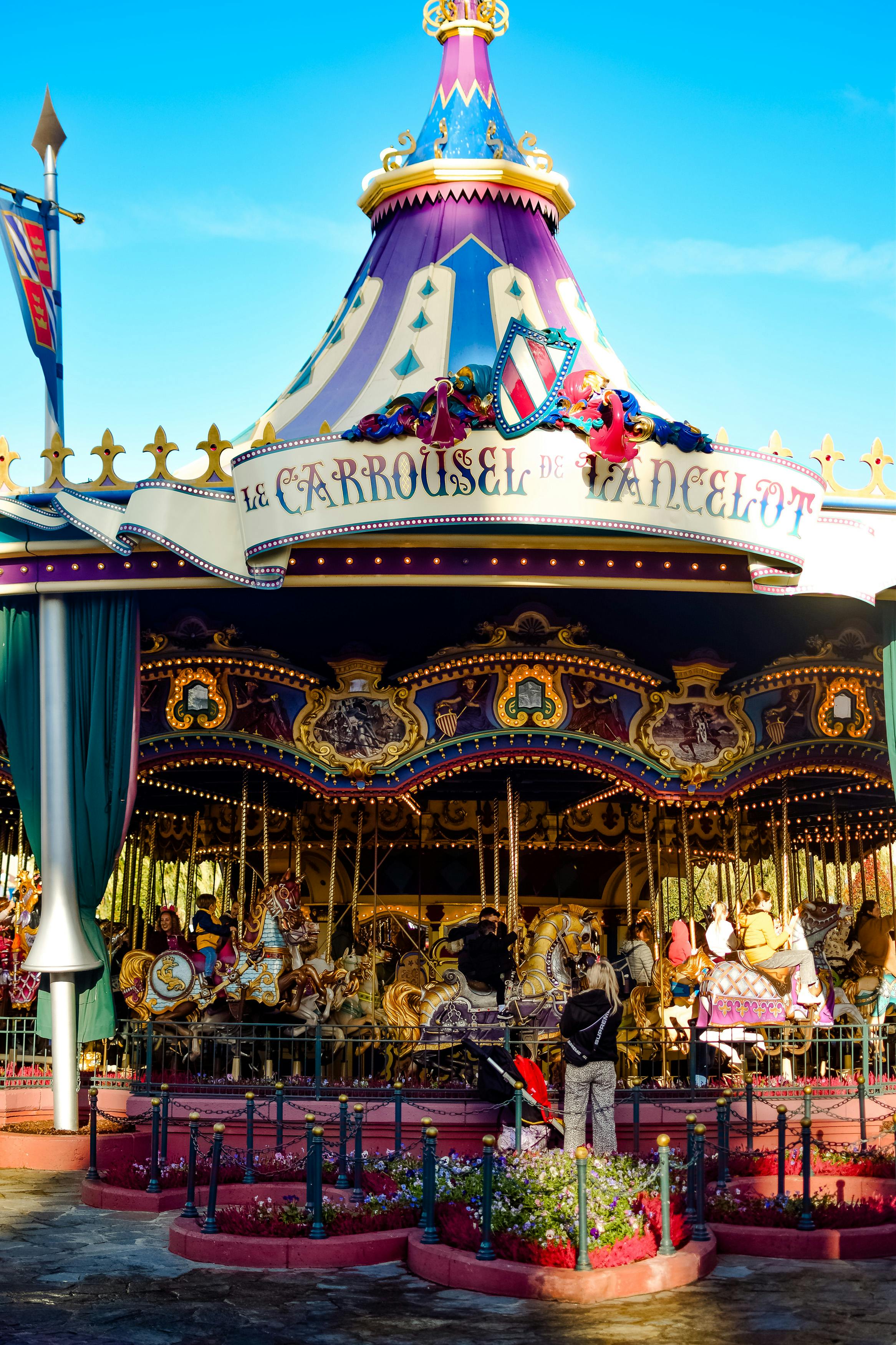 Colorful Le Carrousel de Lancelot on a sunny day, Disneyland Paris.