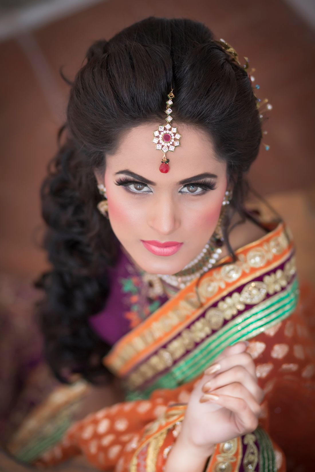 Pakistani bridal portrait in rich traditional wedding attire