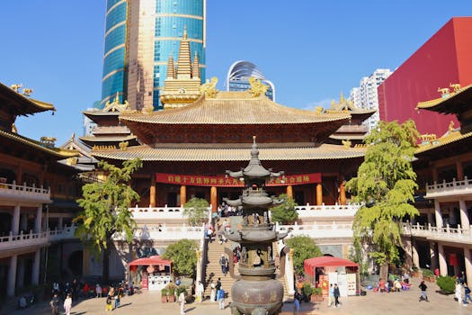 A vibrant scene of Jing'an Temple with modern skyscrapers in Shanghai, China.