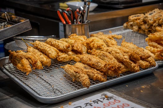 Delicious Korean fried snacks displayed at a street market stall, ready to enjoy.