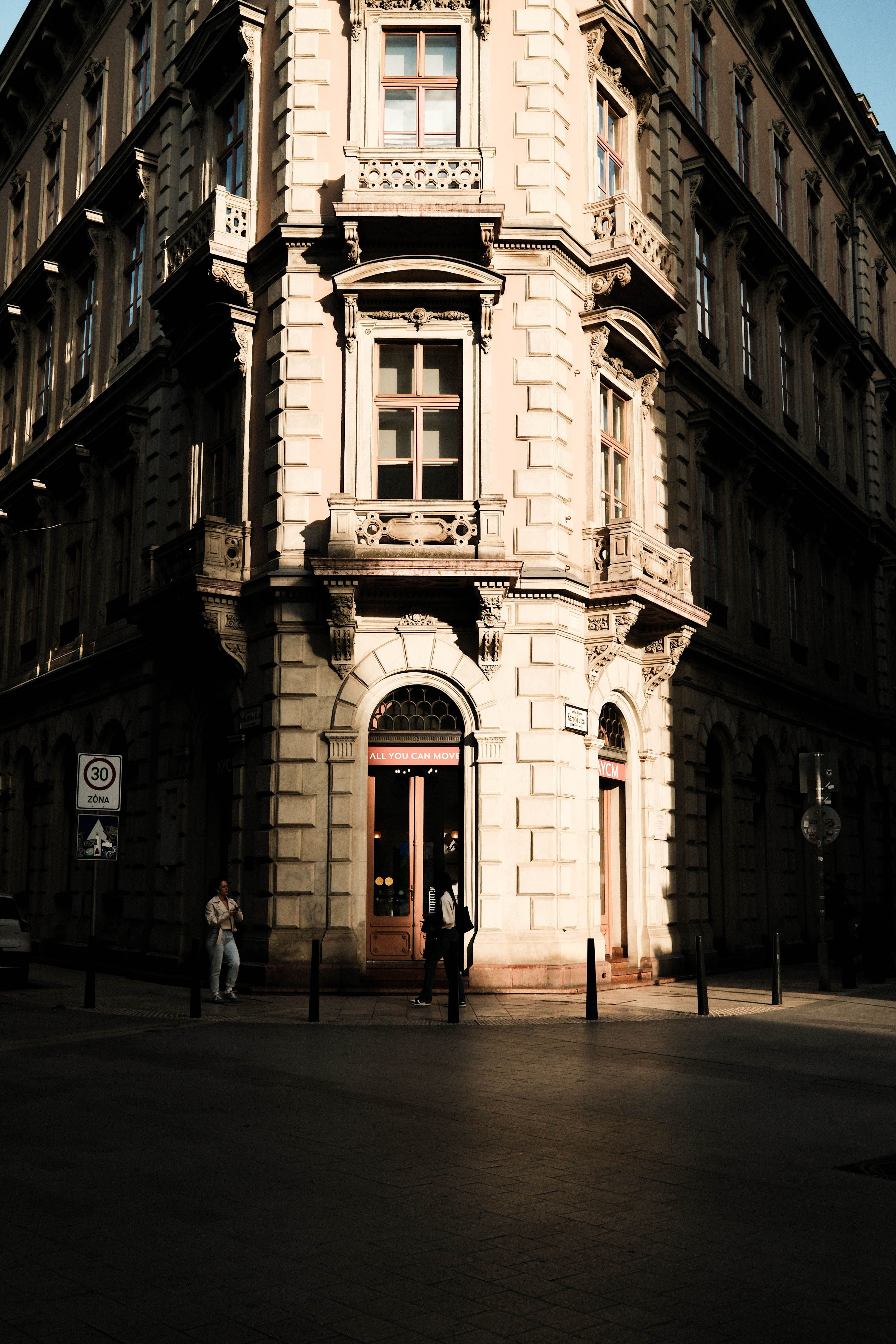 Historic European Corner Building at Sunset · Free Stock Photo