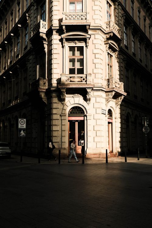 Free Elegant historic architecture at a sunlit street corner in Budapest, Hungary. Stock Photo