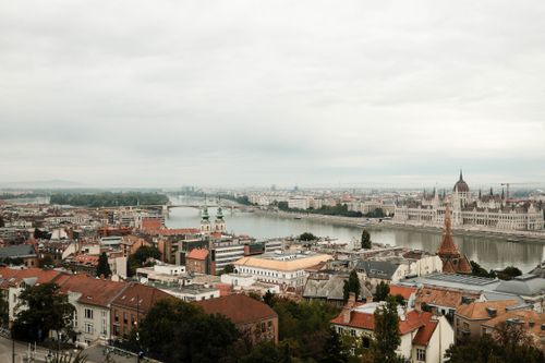 Free Scenic aerial view of Budapest skyline, featuring the Danube River and historic architecture. Stock Photo