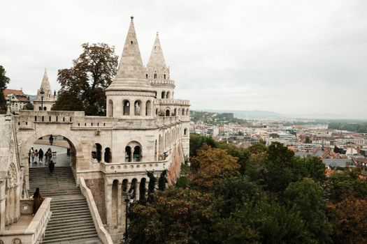 View of Fisherman's Bastion with Budapest cityscape in the background, showcasing historic architecture.