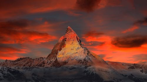 Brown and Gray White Mountain Under Cloudy Blue Sky