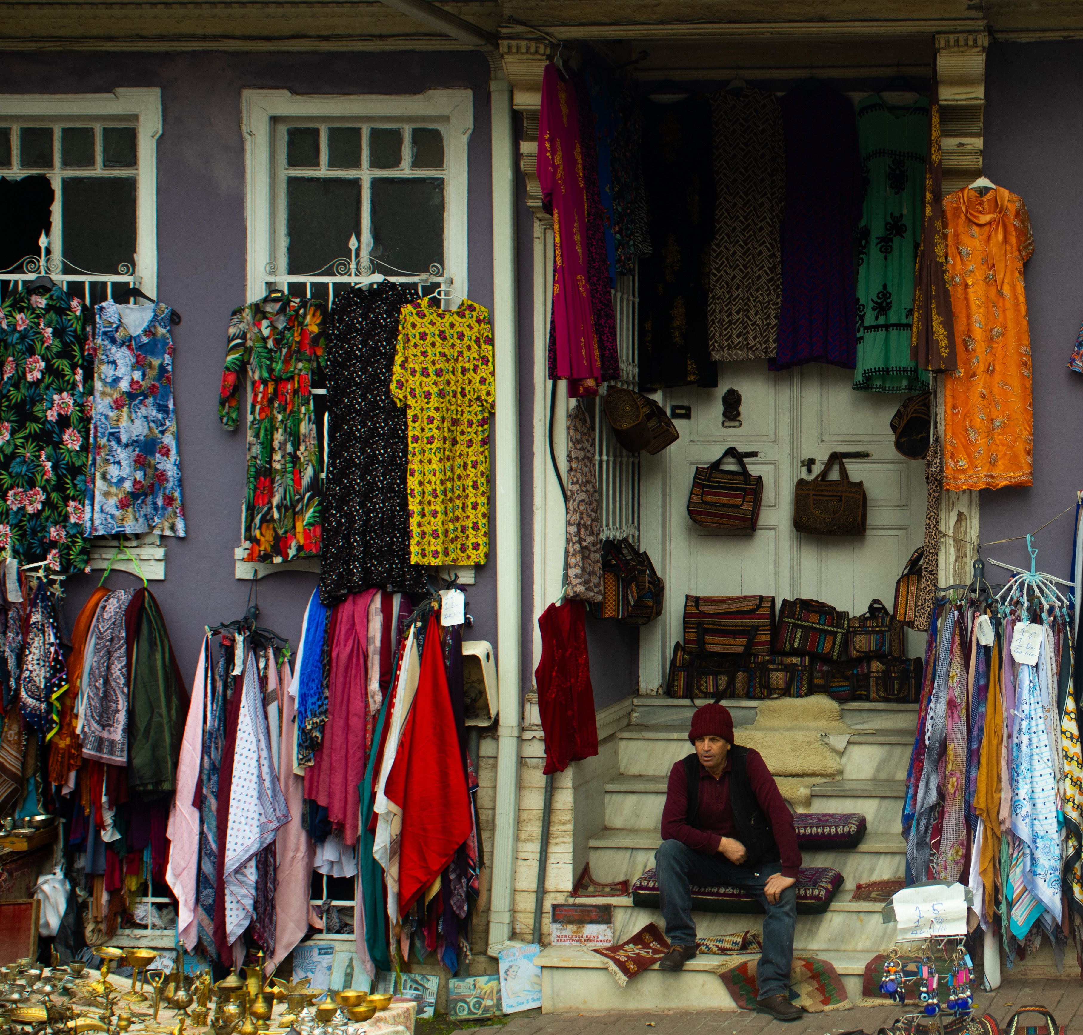 Colorful Clothing Display at Outdoor Market Stall · Free Stock Photo