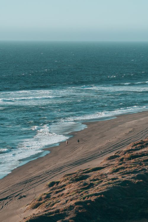 Free Peaceful view of the ocean and sandy beach at Matanzas, Chile. Stock Photo