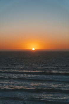 A stunning sunset over the ocean in Matanzas, Chile, with vibrant colors lighting up the sky.