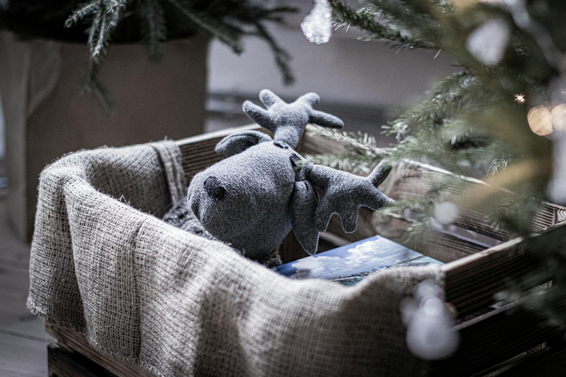 Gray Moose Plush Toy on Crate