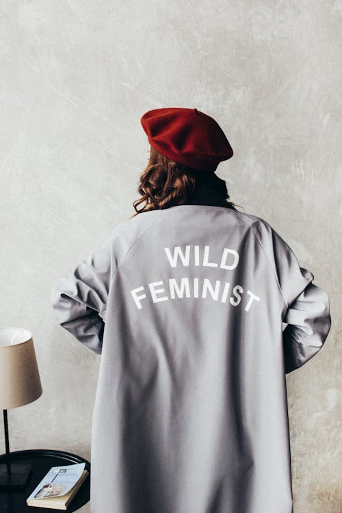 Woman Wearing Red Beret and Gray Long Sleeve Dress with Wild Feminist Print
