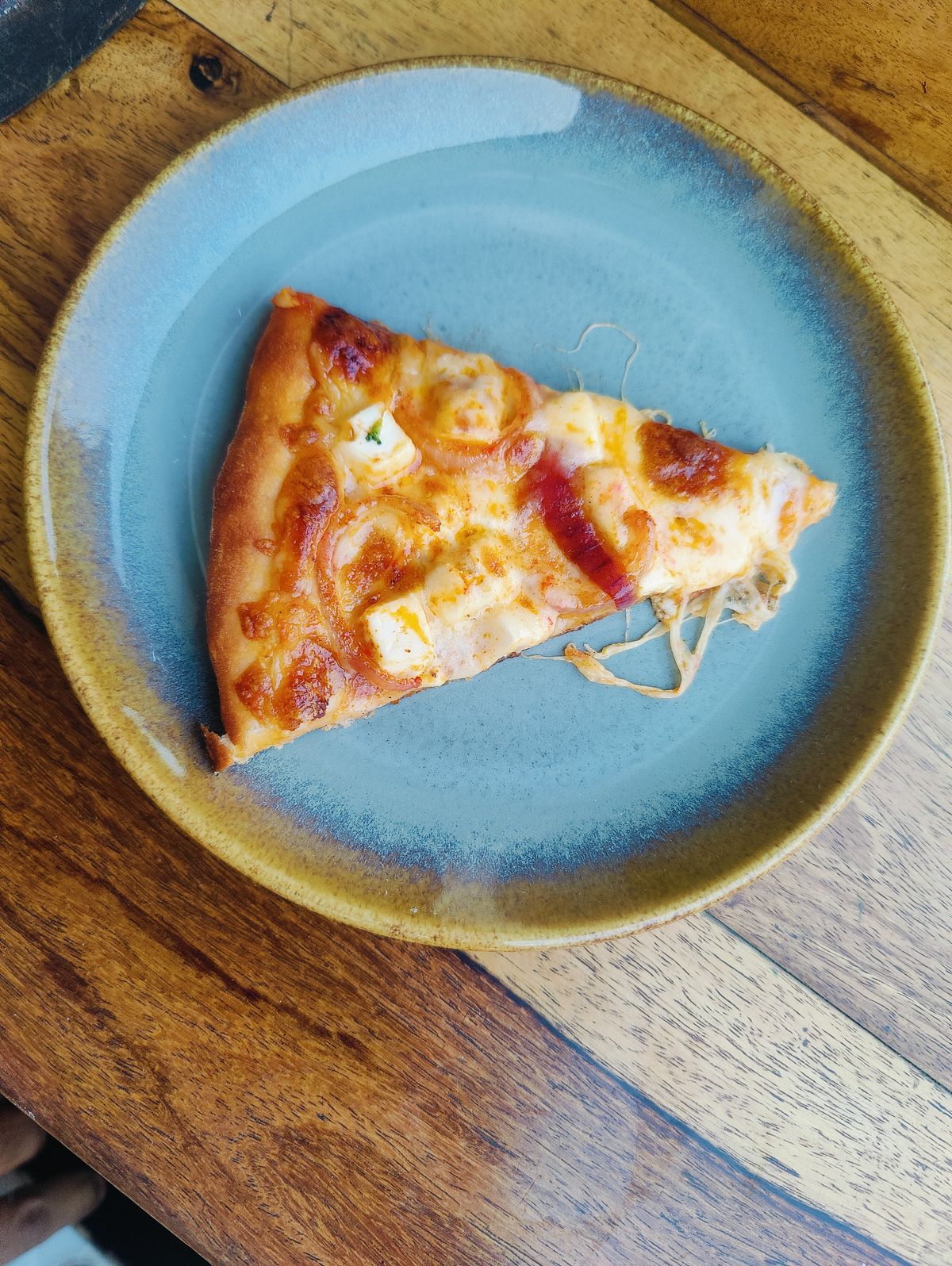 Slice of pizza on a plate
