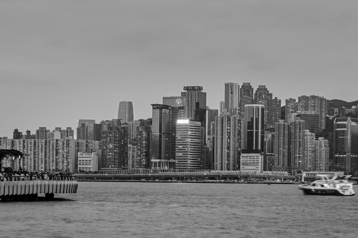 Black and white photograph of Hong Kong skyline with Victoria Harbour
