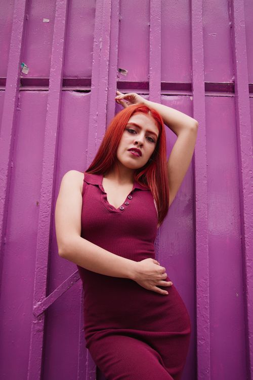 red hair with burgundy dress Red-haired woman in against purple wall · Free Stock Photo what to wear with red hair