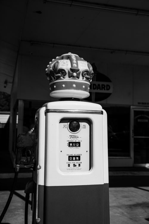 Free Black and white photo of a vintage gas pump with a crown, taken in Trussville, Alabama. Stock Photo