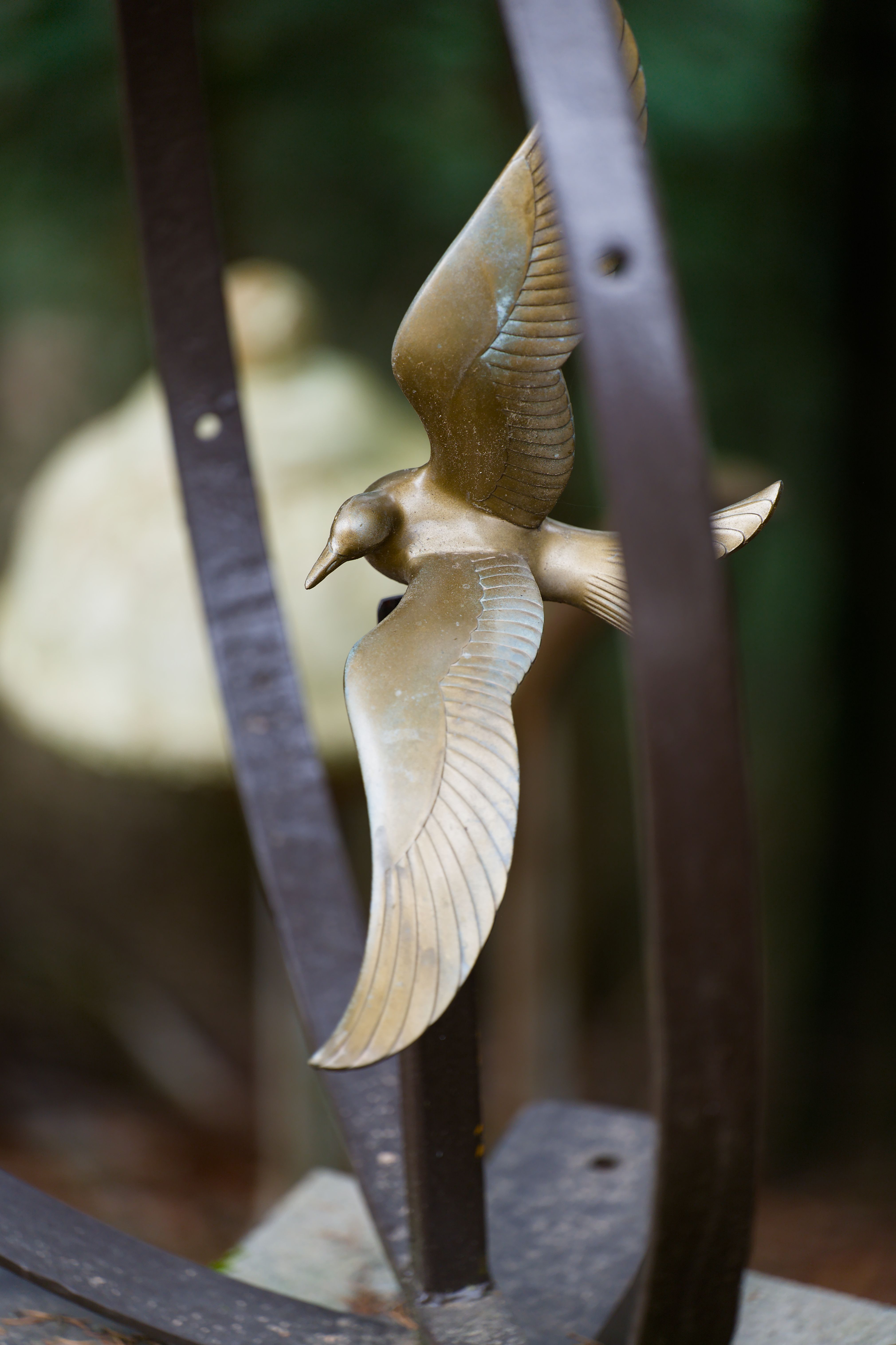 Metal Bird Sculpture in Forest Setting · Free Stock Photo