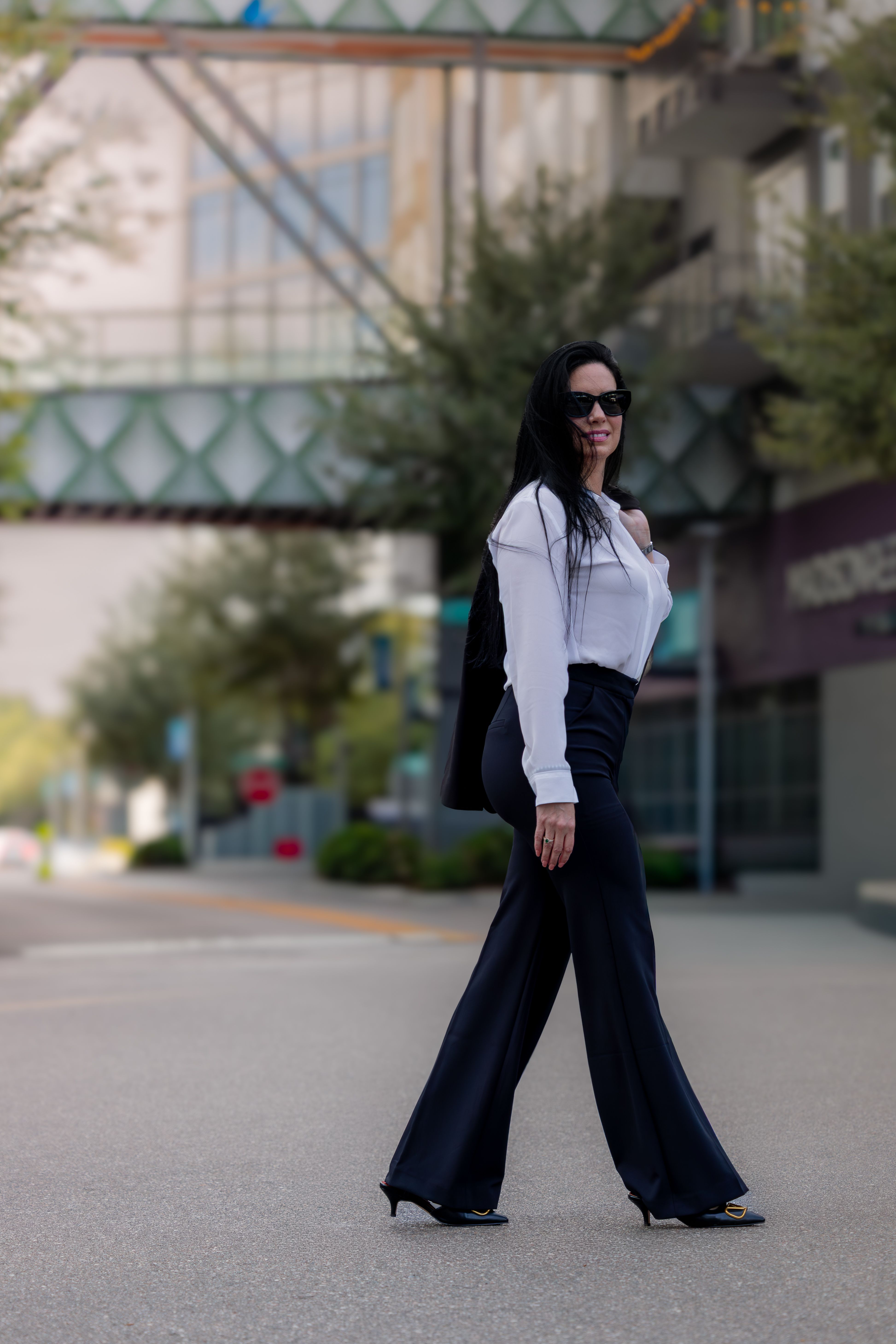 Stylish Woman Walking in Tampa Street Scene · Free Stock Photo