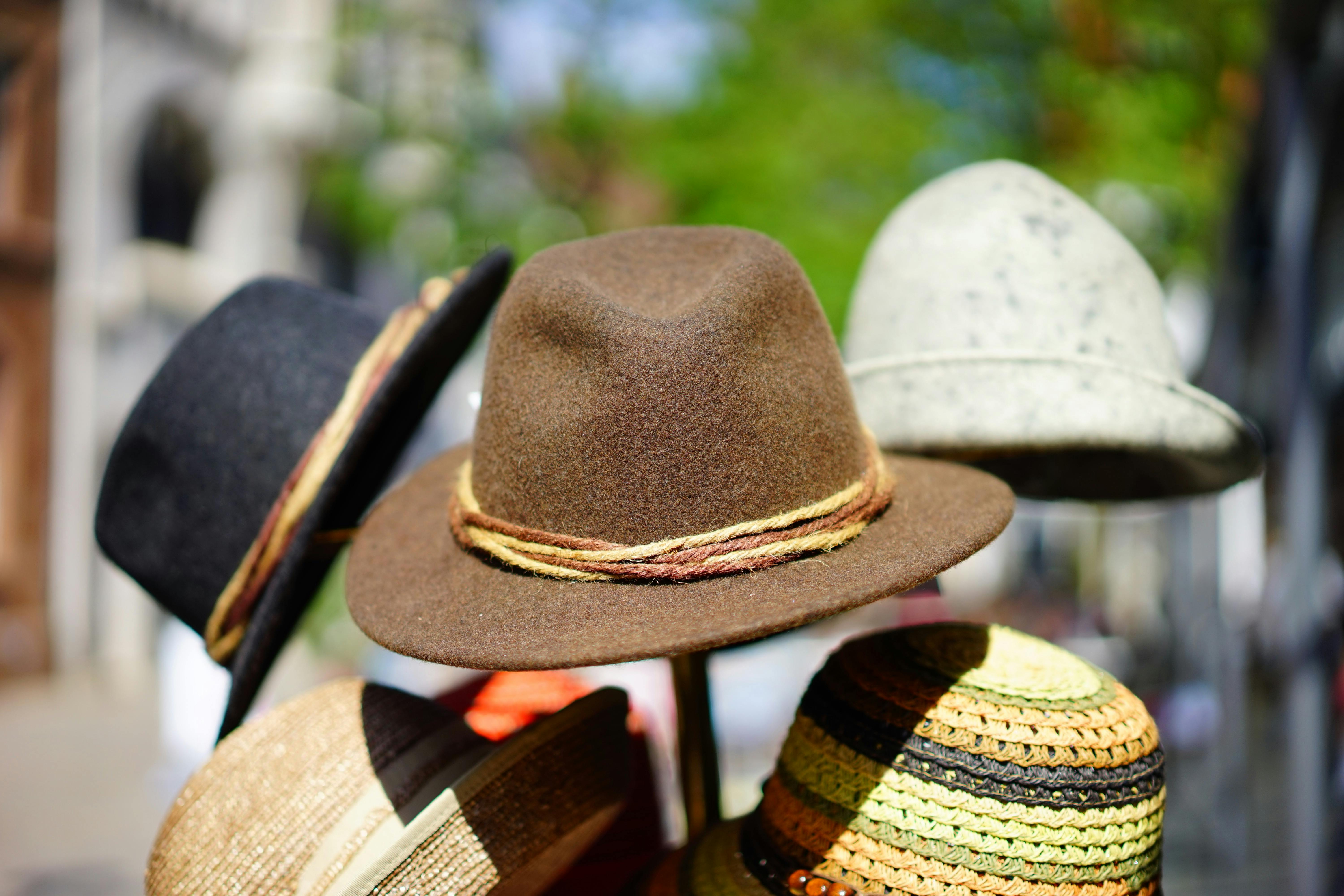 brown fedora hat in selective focus photography