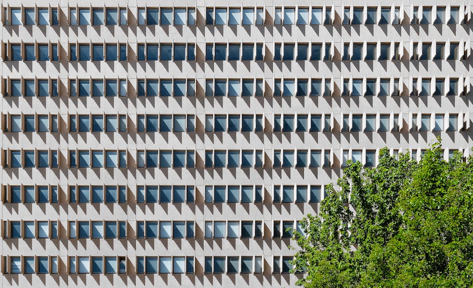 Geometric facade with shadows and greenery in Canberra, Australia.