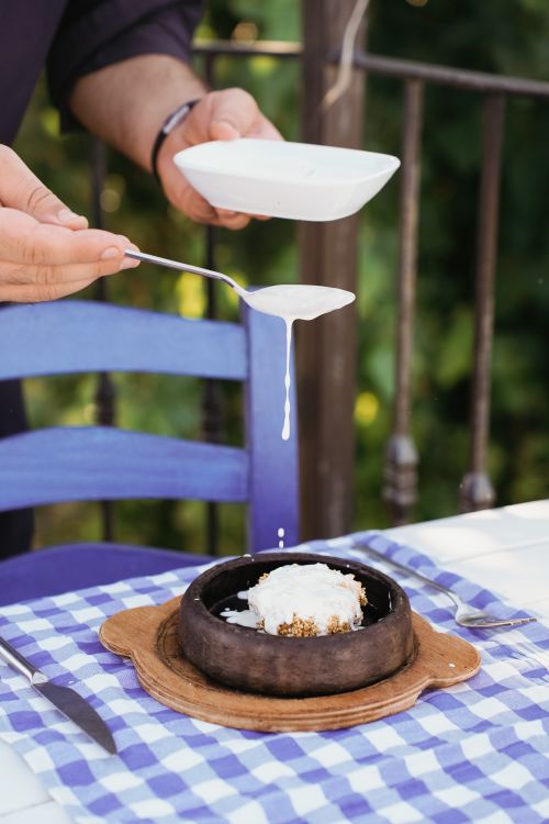 Free Delight in a traditional Turkish dessert served at an outdoor taverna in Gökçeada, Türkiye. Stock Photo