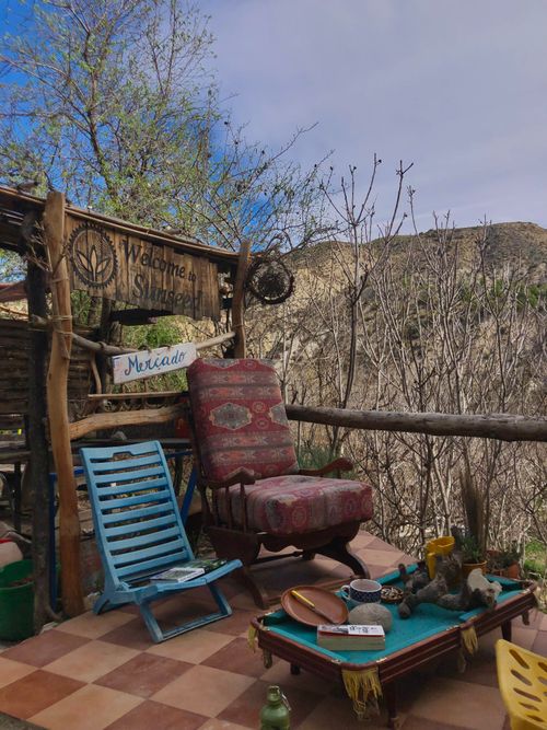 Free Charming rustic seating area in Sorbas, Spain, with handmade signs and natural décor. Stock Photo