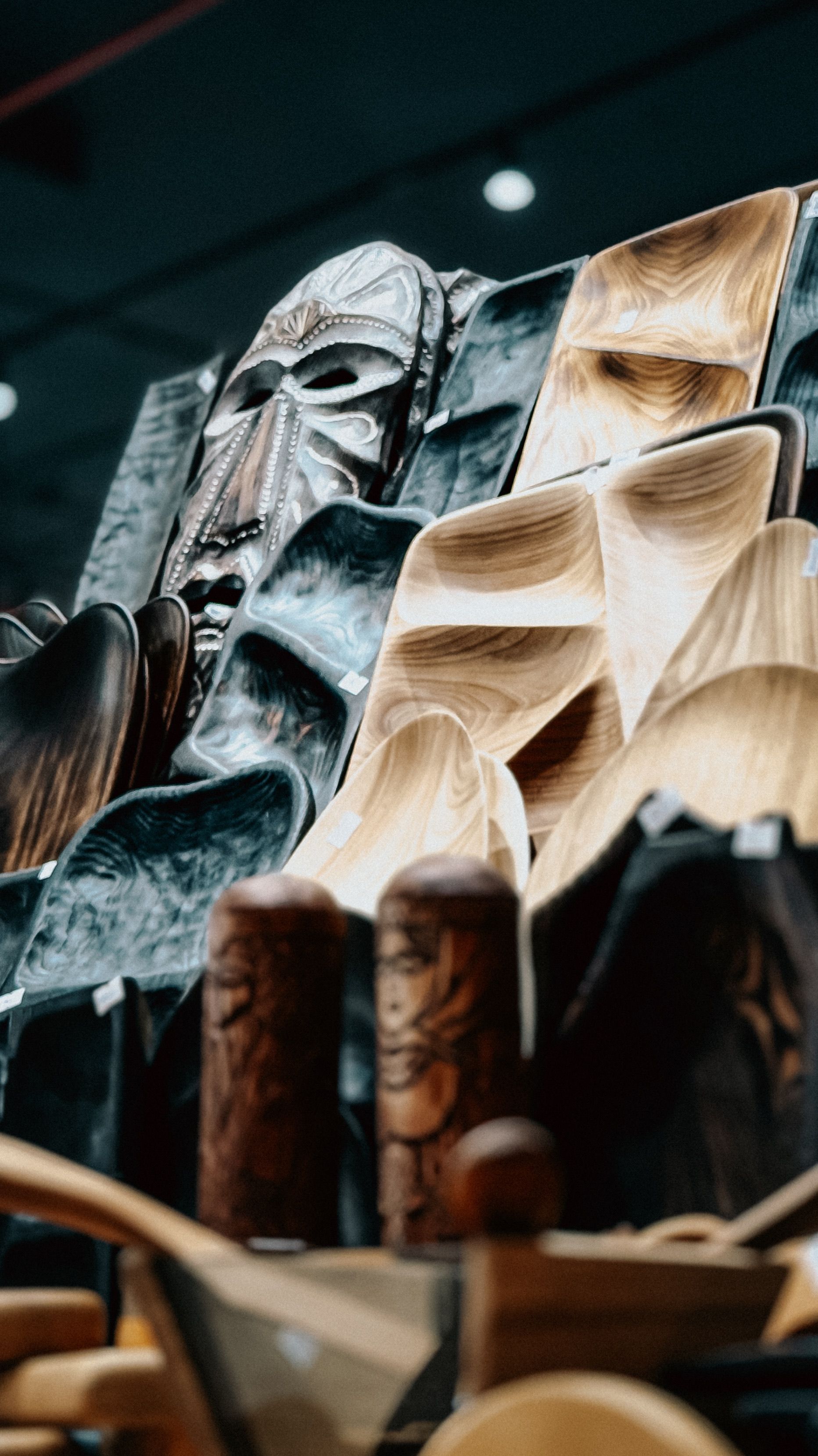 Artistic arrangement of wooden crafts and an African mask, showcasing traditional craftsmanship.