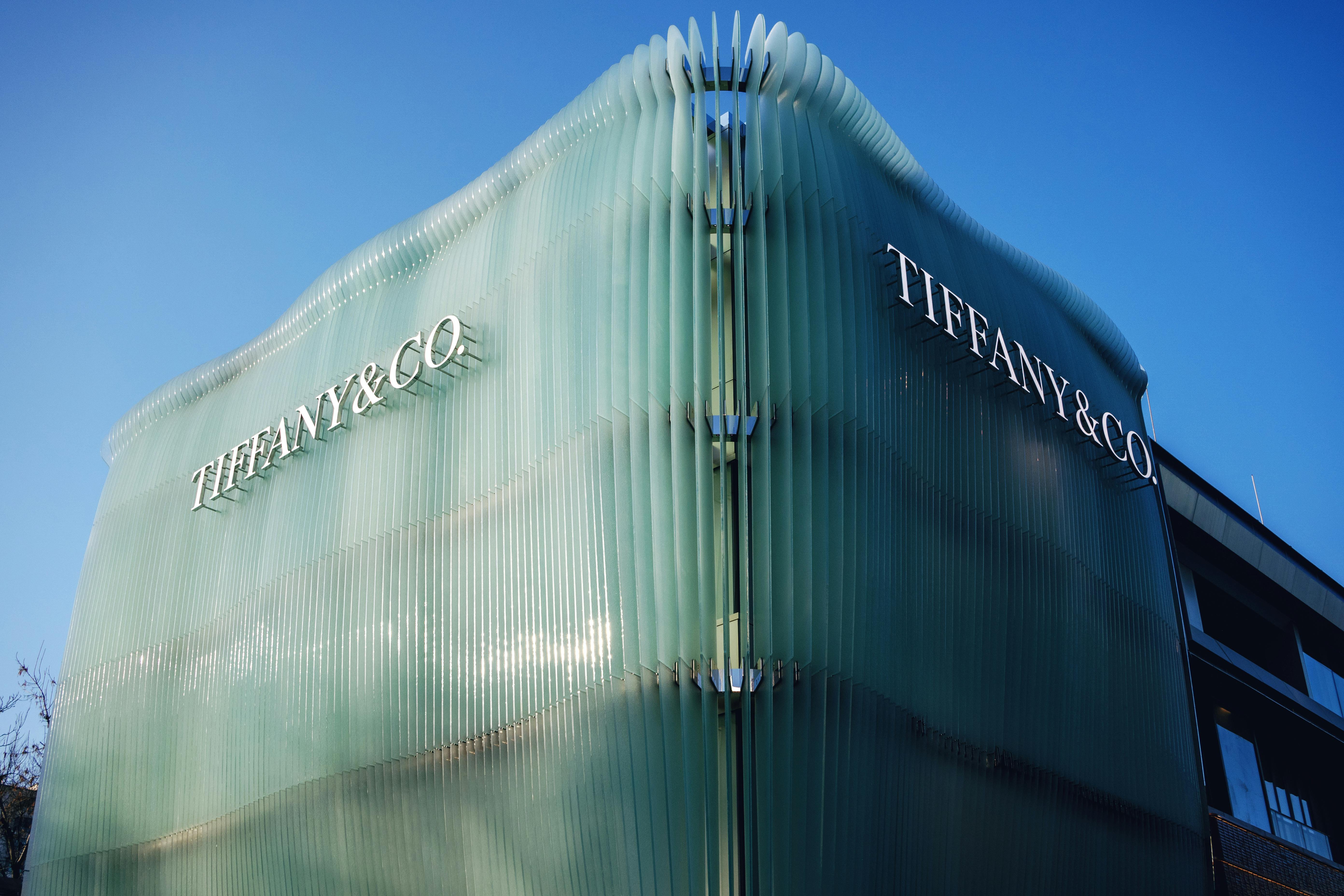 Modern architectural design of Tiffany & Co building with distinctive glass facade.
