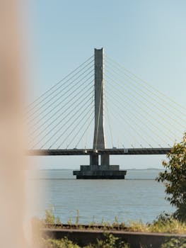 Captivating view of a cable-stayed bridge over calm waters in Laguna, Santa Catarina.