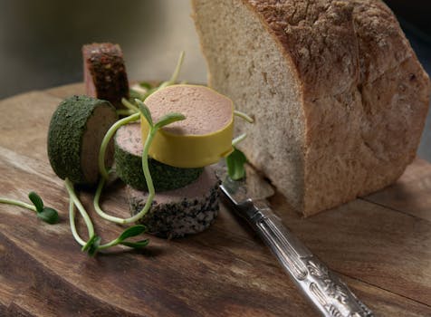 Rustic bread and gourmet cheese selection elegantly displayed on a wooden board, ready for serving.