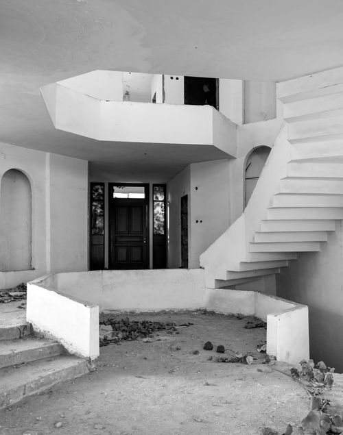 Free Black and white photo of an abandoned building's interior with modern architecture. Stock Photo