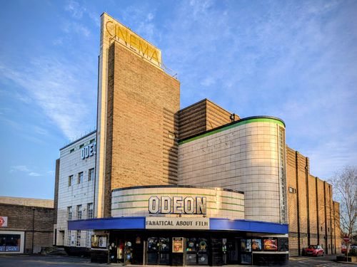 Free Stunning art deco Odeon cinema building in Harrogate, England, under a clear blue sky. Stock Photo