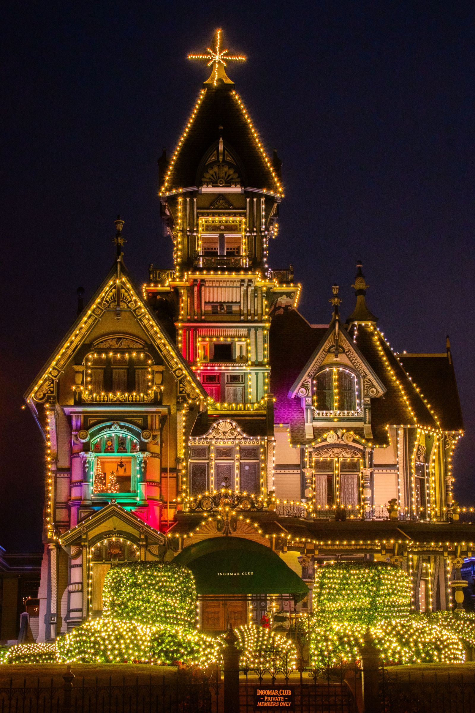 Christmas lights on house at night