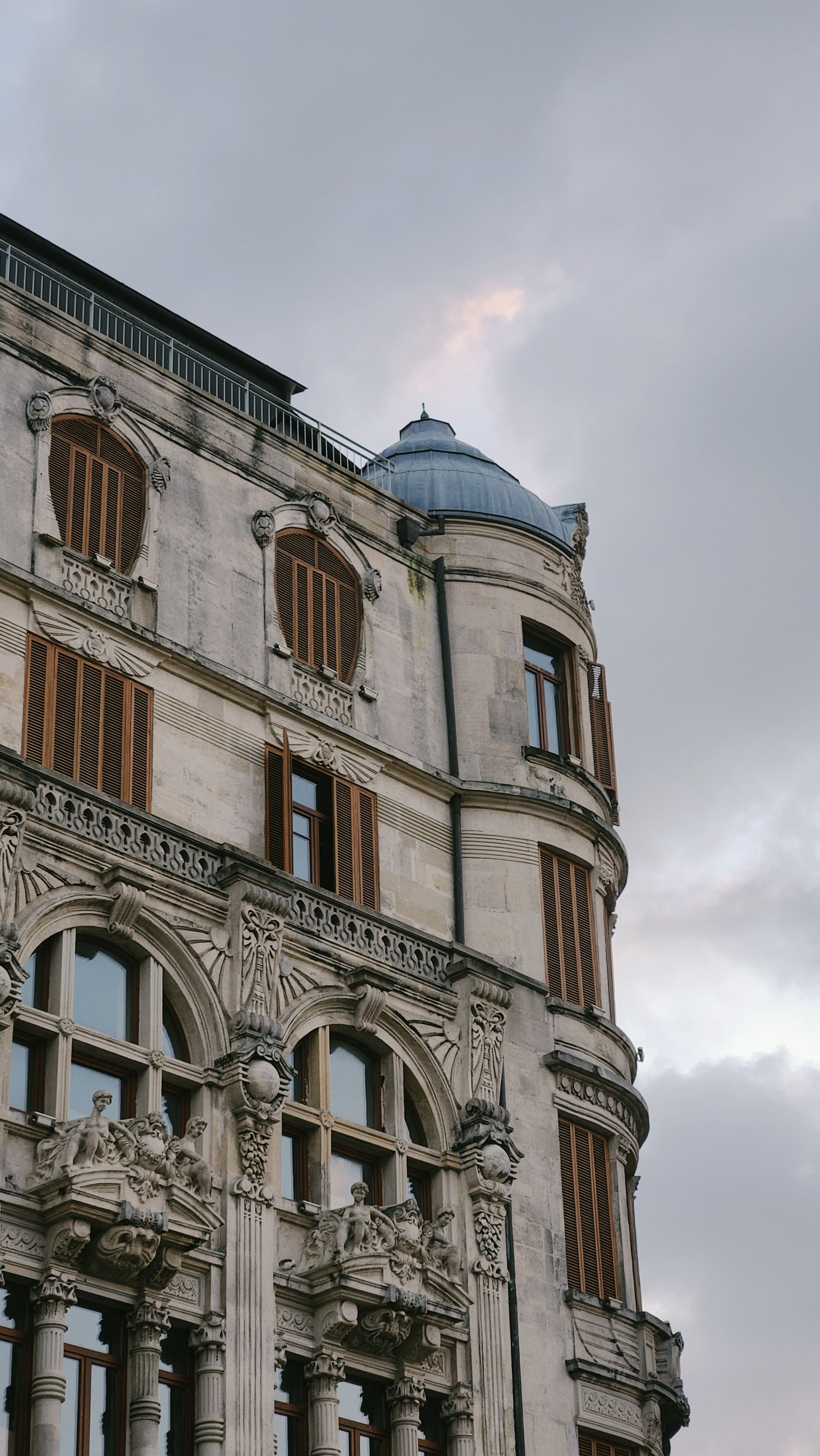 Historic Architectural Facade with Ornate Details · Free Stock Photo